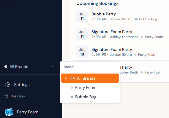 Brand switcher open over the upcoming-bookings list — All Brands selected, with each booking tagged by the brand it belongs to and the switcher offering the account's two brands or all of them at once